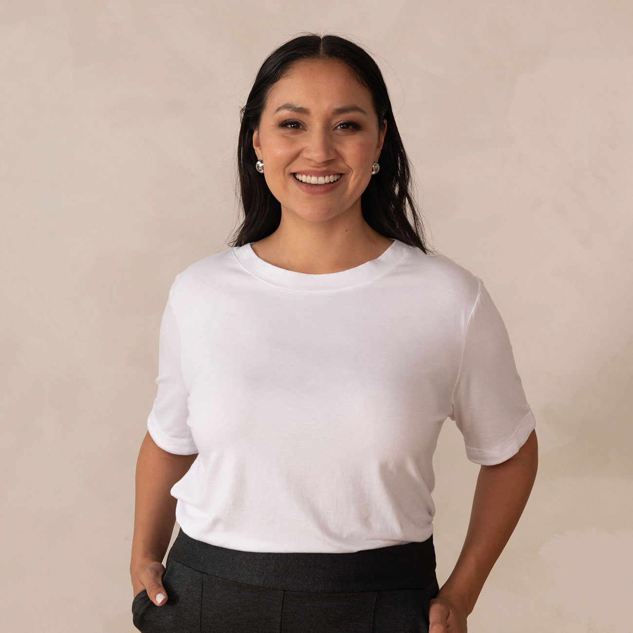 woman wearing a white scoop neck t-shirt