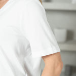 detail of white sleeve of a t-shirt