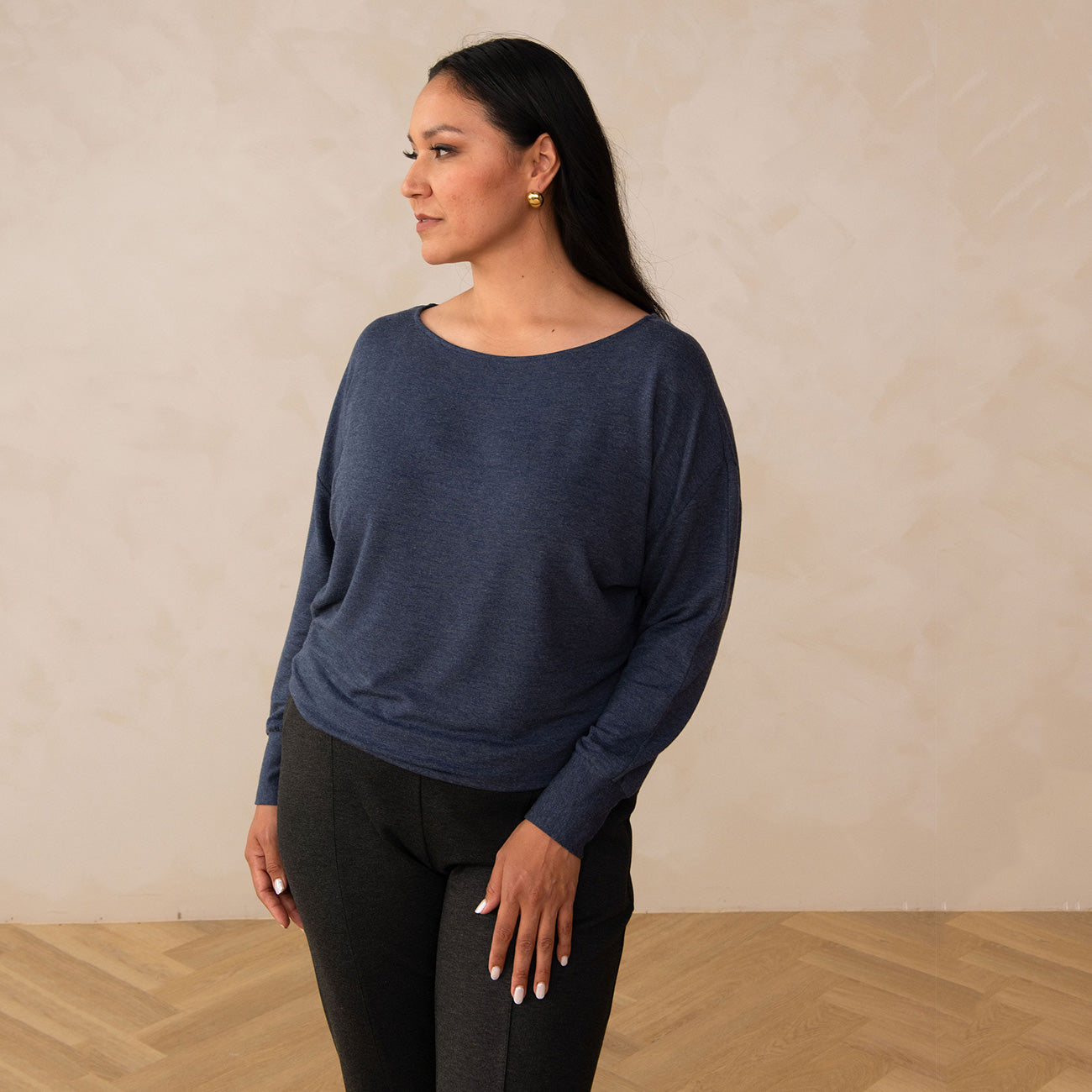 woman wearing a navy long sleeve sweatshirt