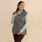 woman wearing a heirloom grey vest and a light grey turtleneck