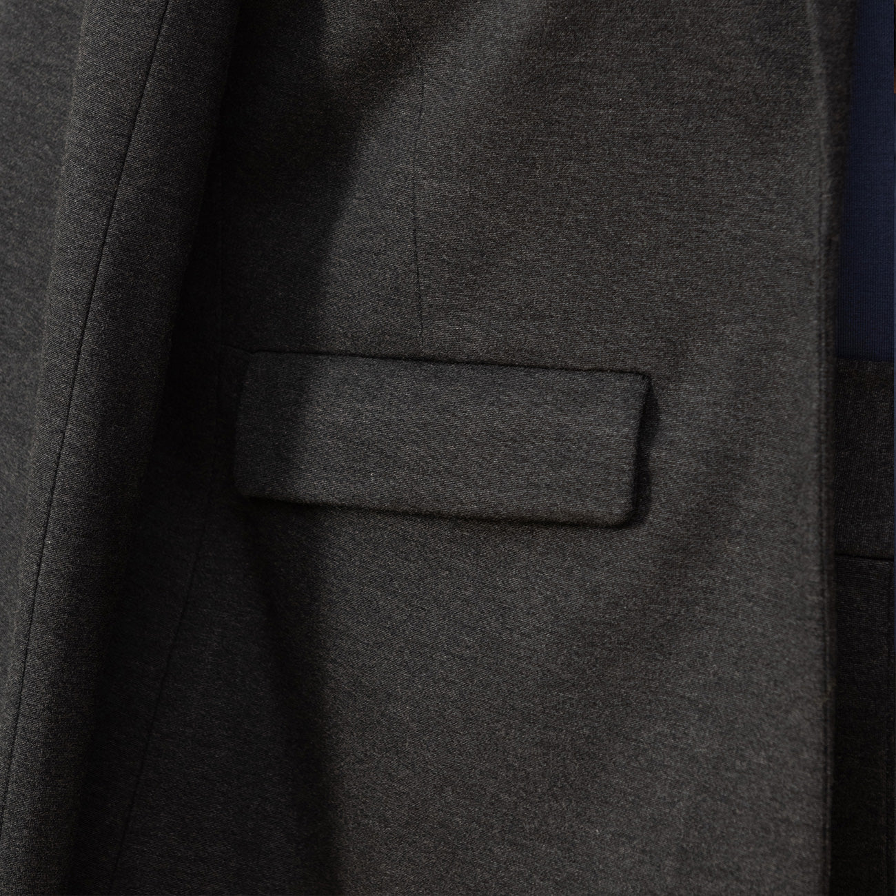 close up of pocket of a grey blazer