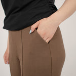 detail of pocket of brown tailored pant