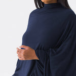 Woman wearing navy blue versatile dress as shall