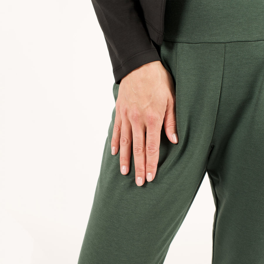 Woman wearing green stretchy sweatpants