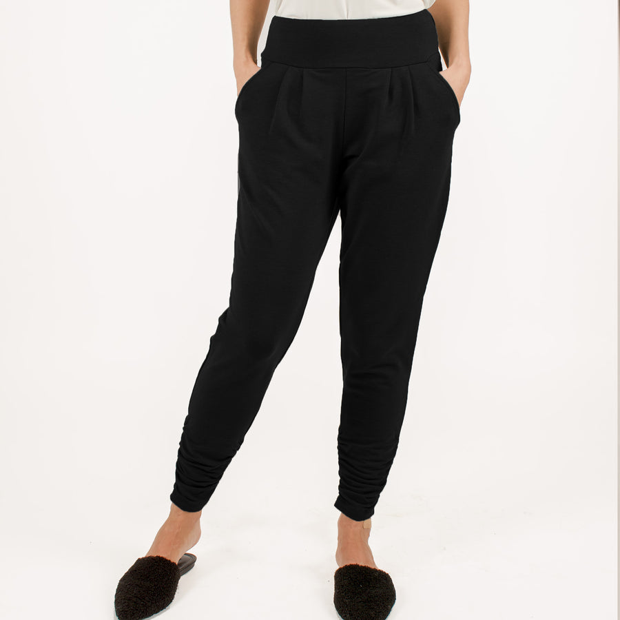 Woman wearing black stretchy sweatpants