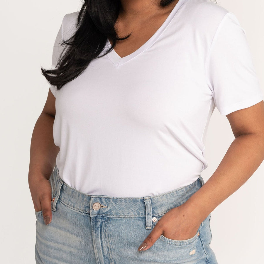 Woman wearing white v-neckline t-shirt with jeans