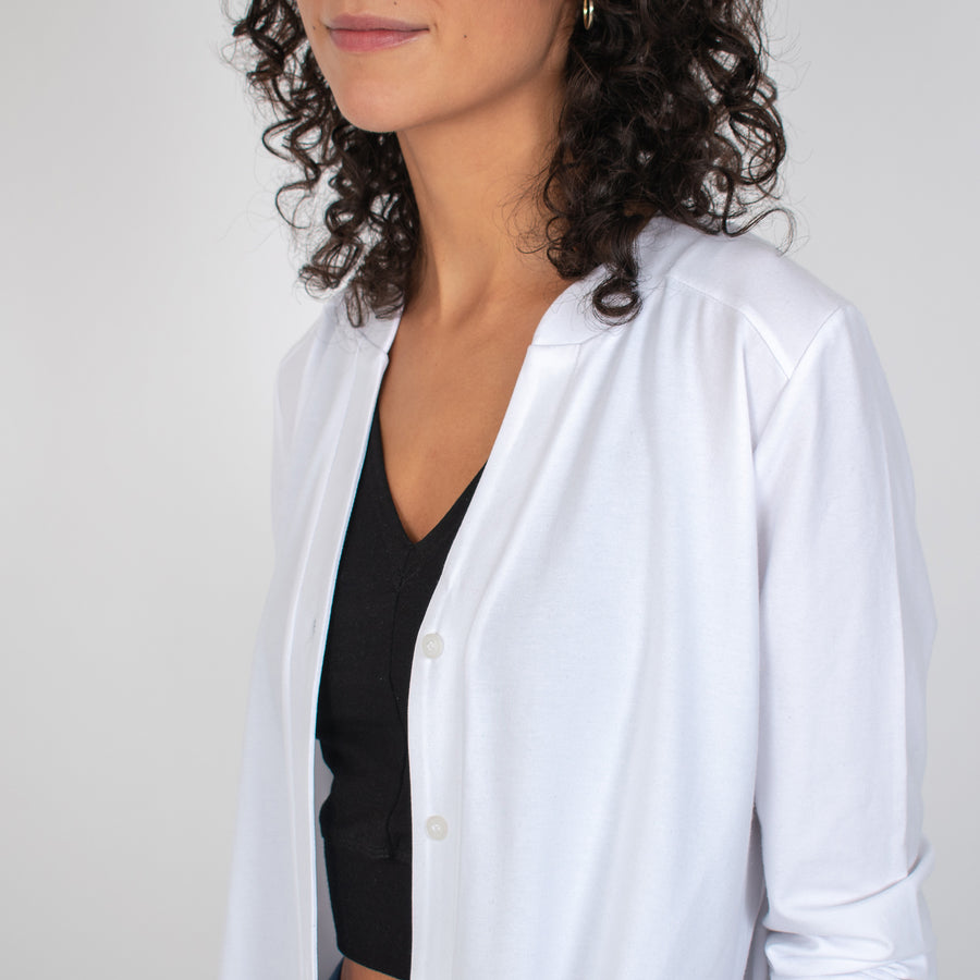 Woman wearing white long sleeve button up shirt