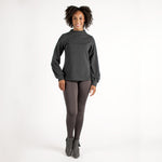 Woman wearing fitted light brown high-rise waist with ankle length leggings featuring seamless stitching and a hidden back pocket 